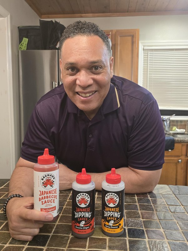 Nick with three bottles of Bachan's sauce